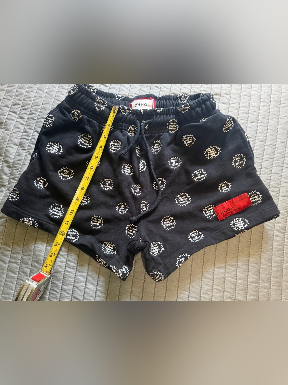 Black CHNGE sweatshirt shorts with LGBTQ+ positive statement embroidery